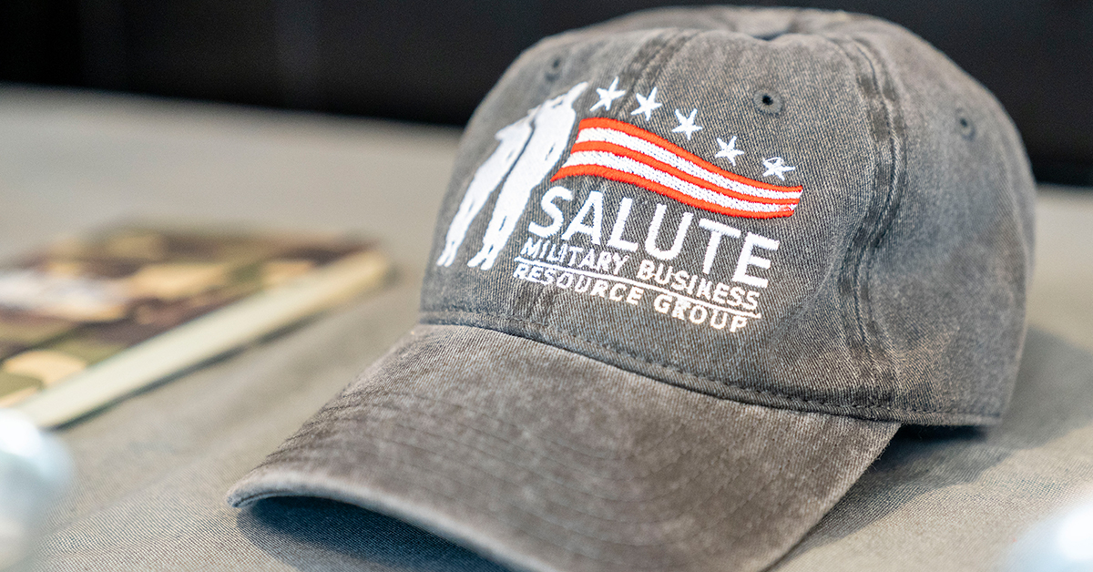 Grey baseball hat with Salute BRG logo to show how veterans are valued at Capital One